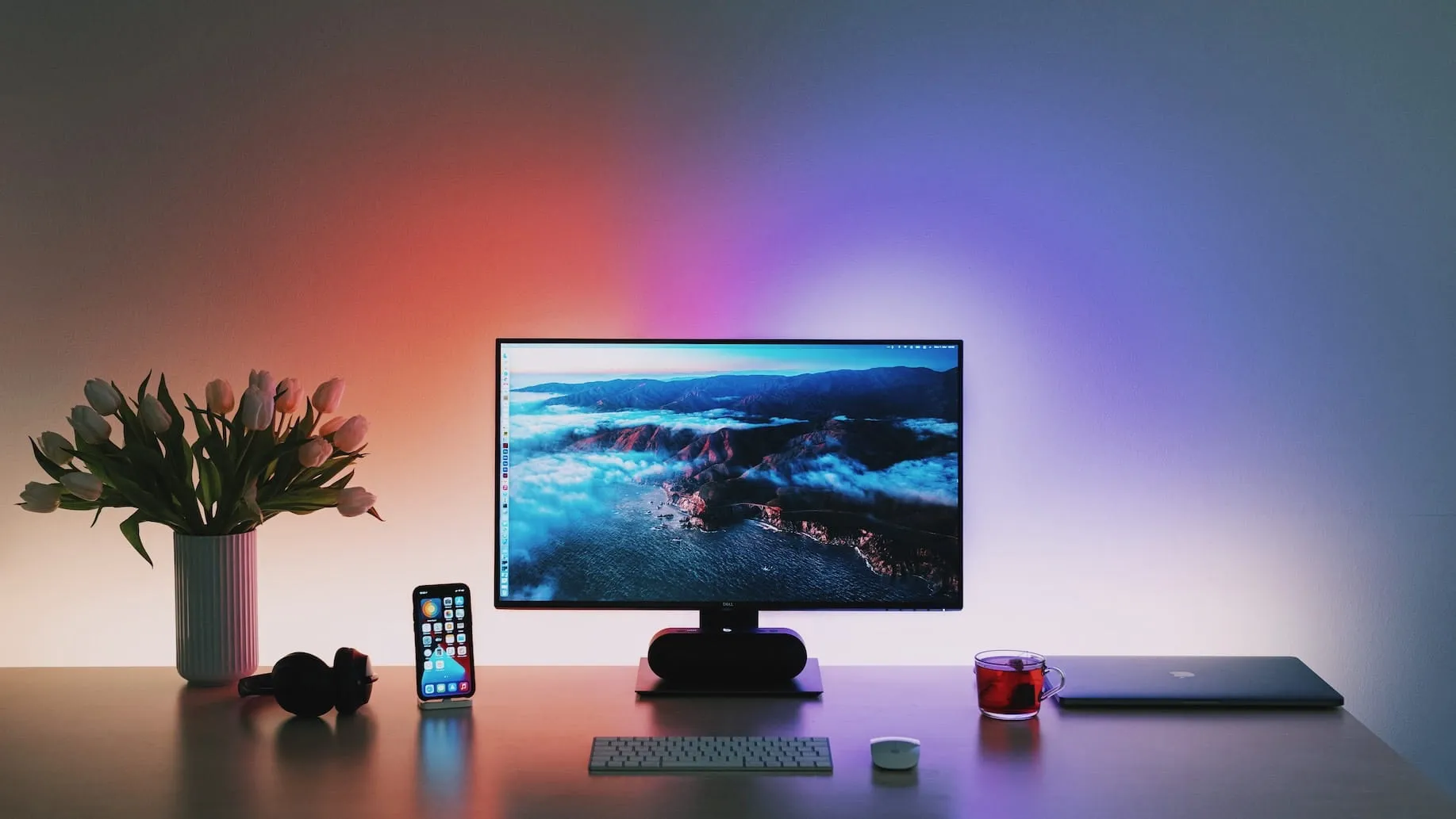 Flat screen computer monitor on wooden desk